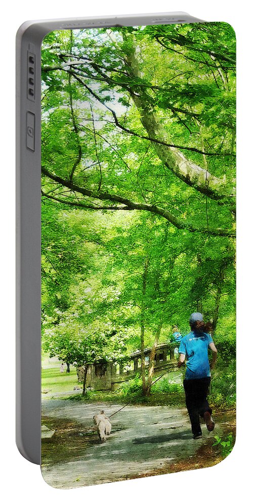 Jogging Portable Battery Charger featuring the photograph Girl Jogging with Dog by Susan Savad