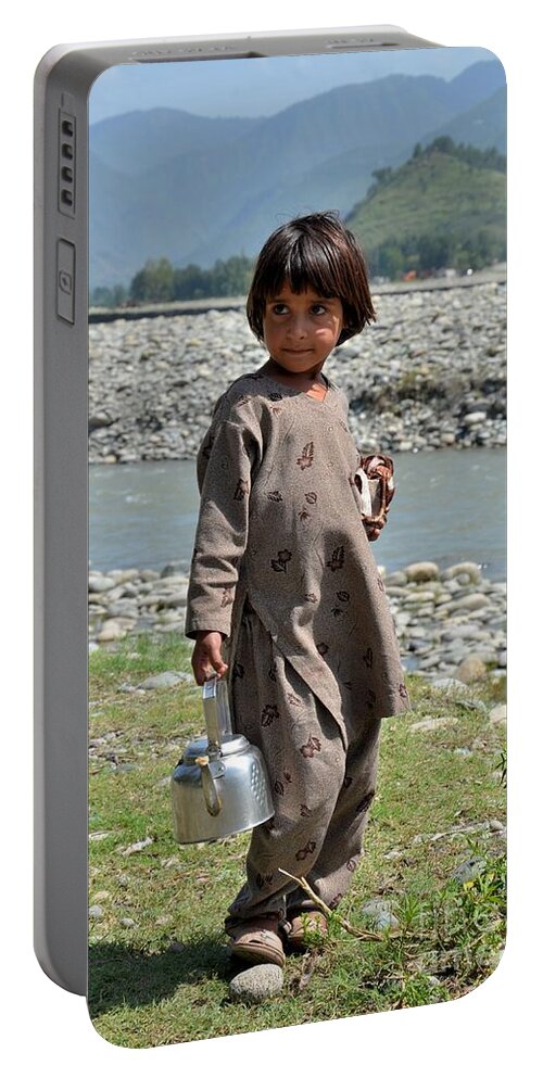 Girl Portable Battery Charger featuring the photograph Girl poses for camera by Imran Ahmed