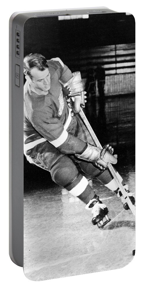 Gordie Portable Battery Charger featuring the photograph Gordie Howe skating with the puck by Gianfranco Weiss