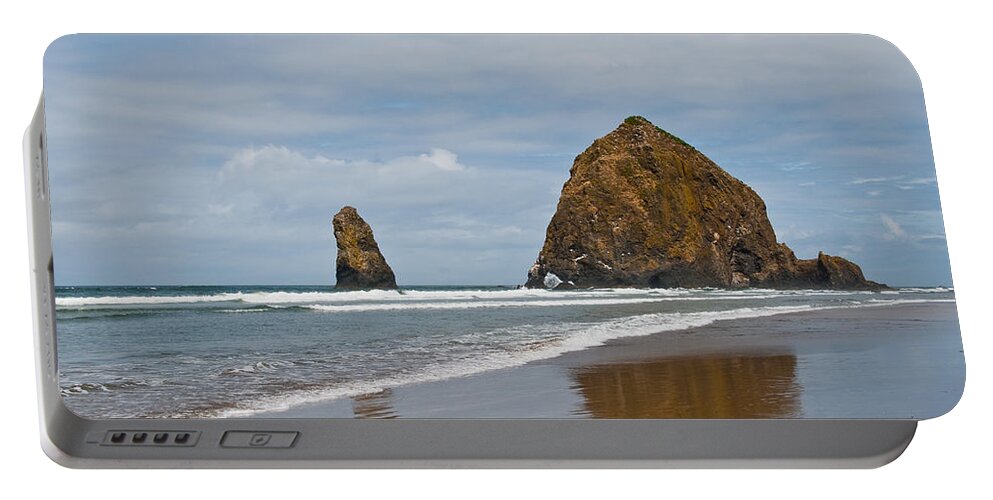 Beach Portable Battery Charger featuring the photograph Haystack Rock Reflected in the Wet Sand by Jeff Goulden