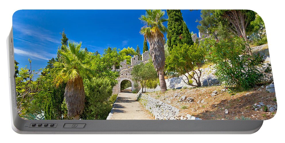 Hvar Portable Battery Charger featuring the photograph Historic Hvar fortification wall in nature by Brch Photography