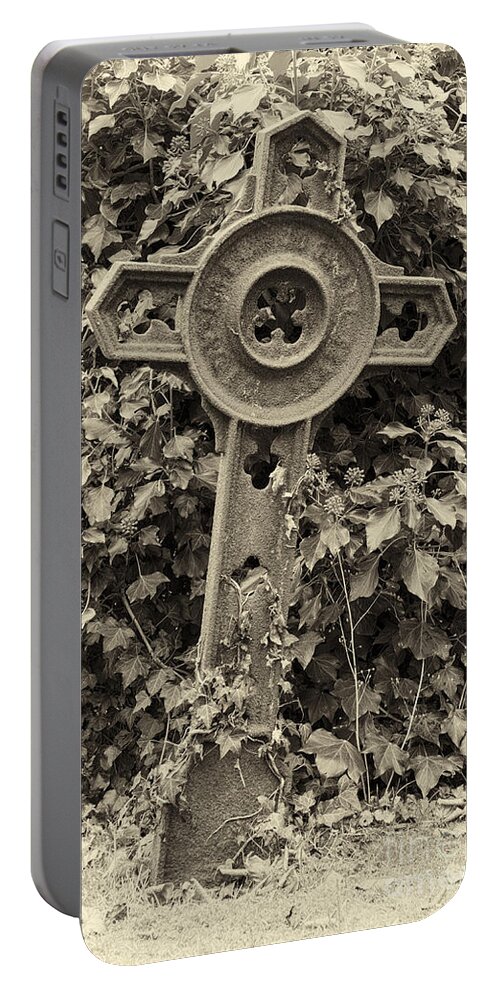 Cross Portable Battery Charger featuring the photograph Iron grave marker - toned by Steev Stamford
