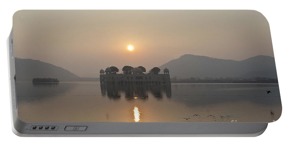 Sunrise Portable Battery Charger featuring the photograph Jal Mahal in sunrise by Elena Perelman