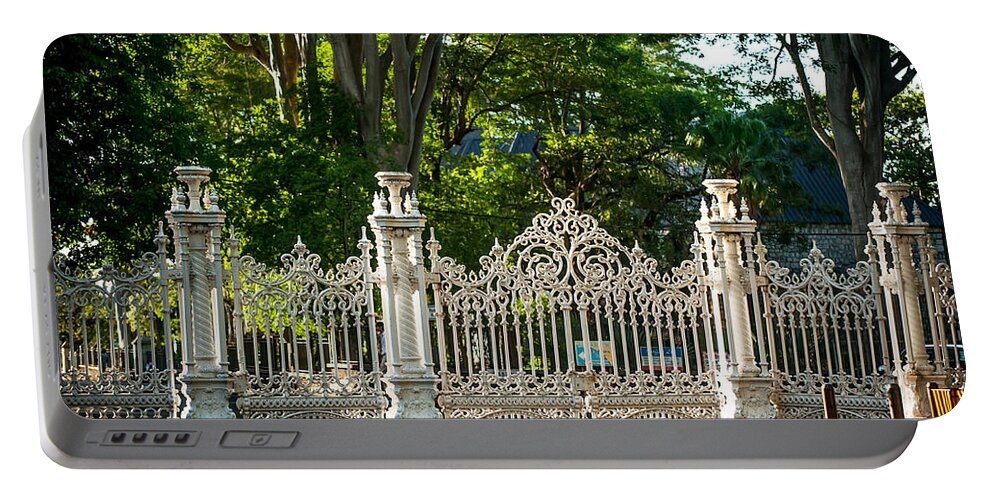 Fence Portable Battery Charger featuring the photograph Lacy Gates and Fence of the Pamplemousse Botanical Garden. Mauritius by Jenny Rainbow