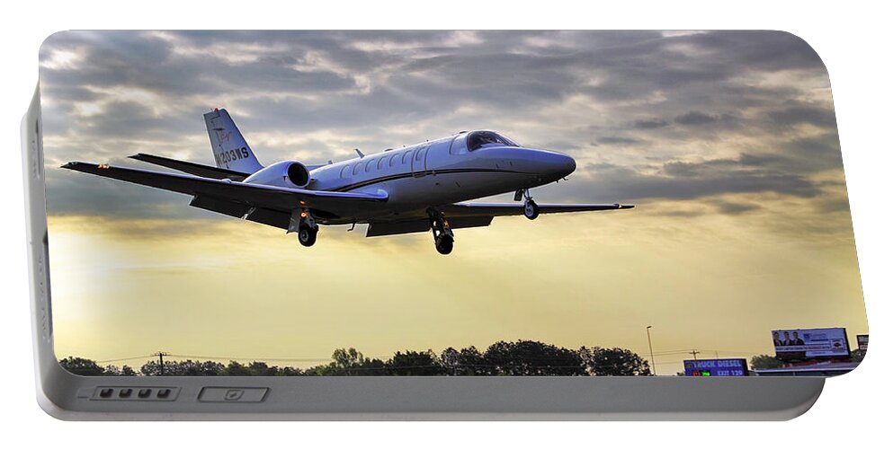 Airplane Portable Battery Charger featuring the photograph Landing at Sunrise by Jason Politte