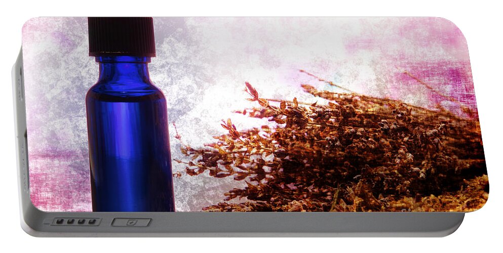 Aromatherapy Portable Battery Charger featuring the photograph Lavender Essential Oil Bottle by Olivier Le Queinec