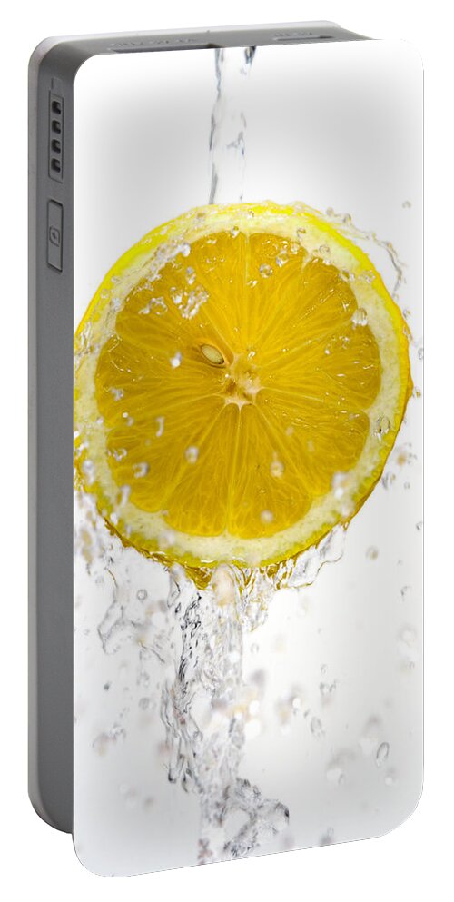 Lemon Portable Battery Charger featuring the photograph Lemon Splash by Alexey Stiop