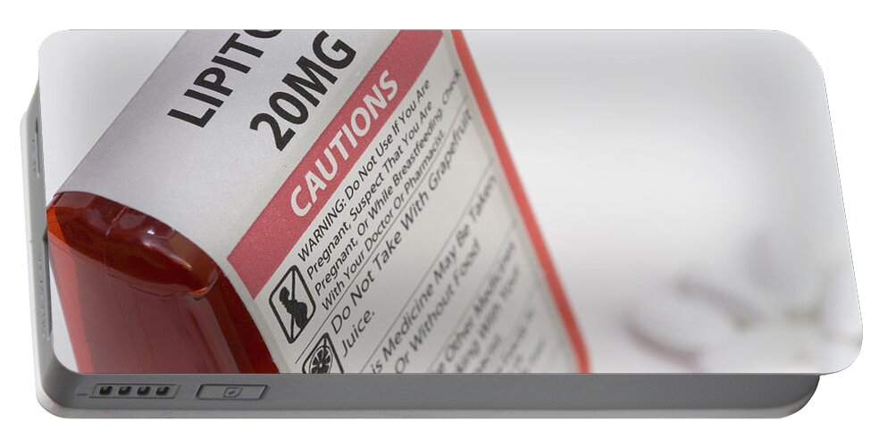 Ldl Portable Battery Charger featuring the photograph Lipitor Warning Label by Science Stock Photography
