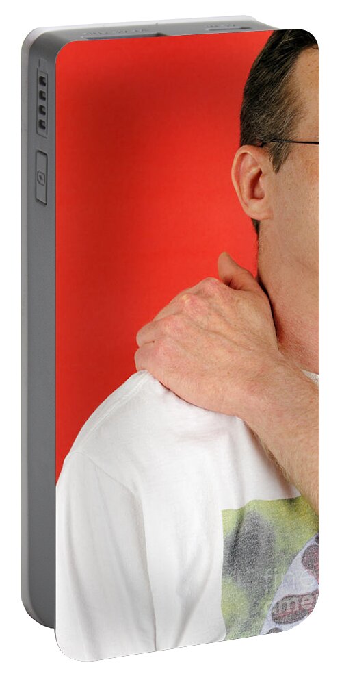 Man Portable Battery Charger featuring the photograph Man Massaging His Shoulder by Lee Serenethos