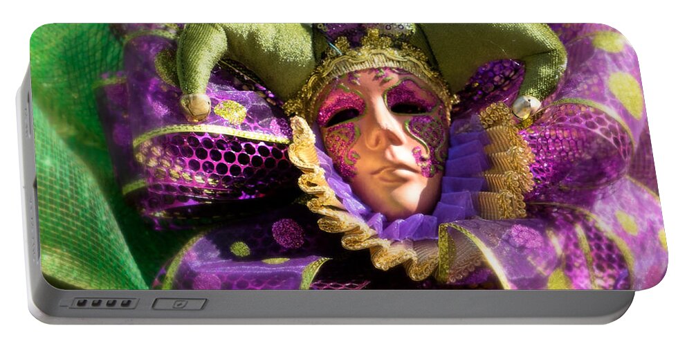 Carnival Portable Battery Charger featuring the photograph Mardi Gras Decoration by Jerry Fornarotto