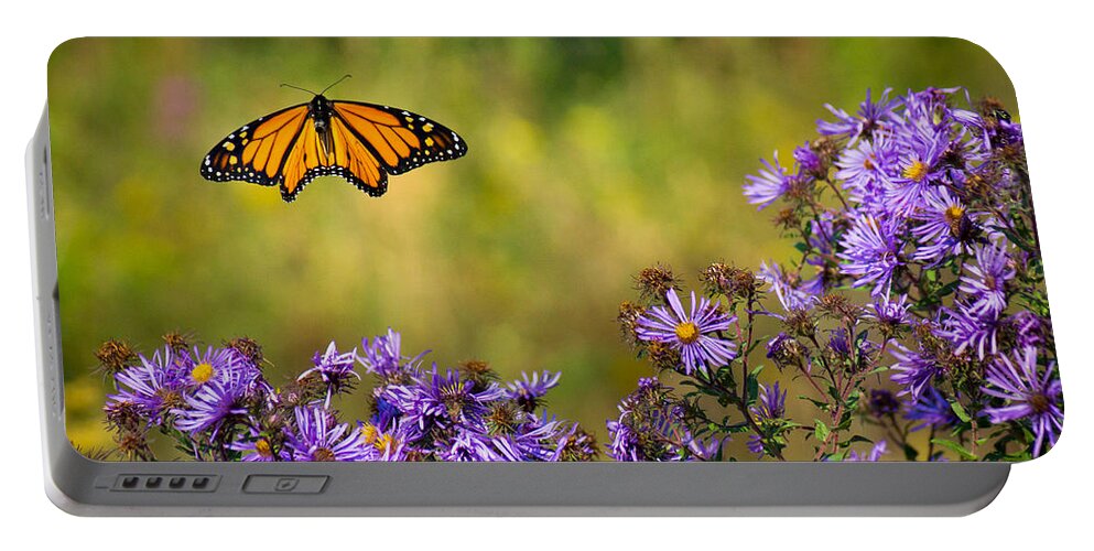 Color Portable Battery Charger featuring the photograph Monarch Flight by Bill Pevlor