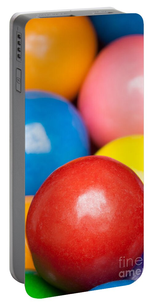 Childhood Portable Battery Charger featuring the photograph Multi-colored gumballs by Bryan Mullennix