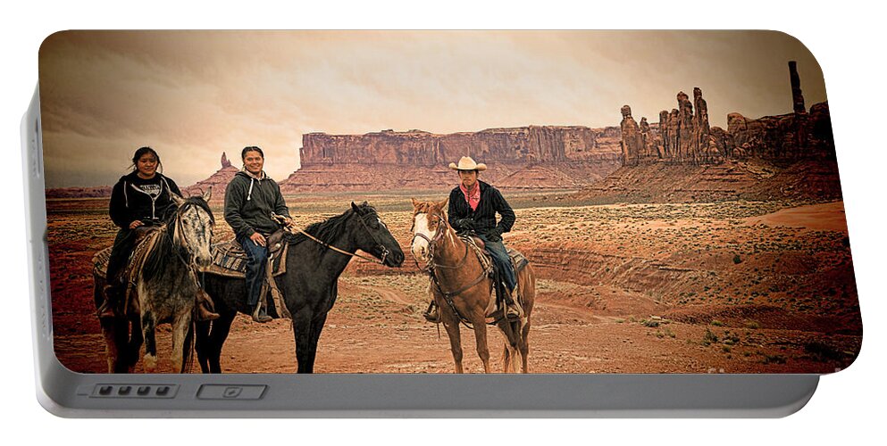 Red Soil Portable Battery Charger featuring the photograph Navajo Riders by Jim Garrison