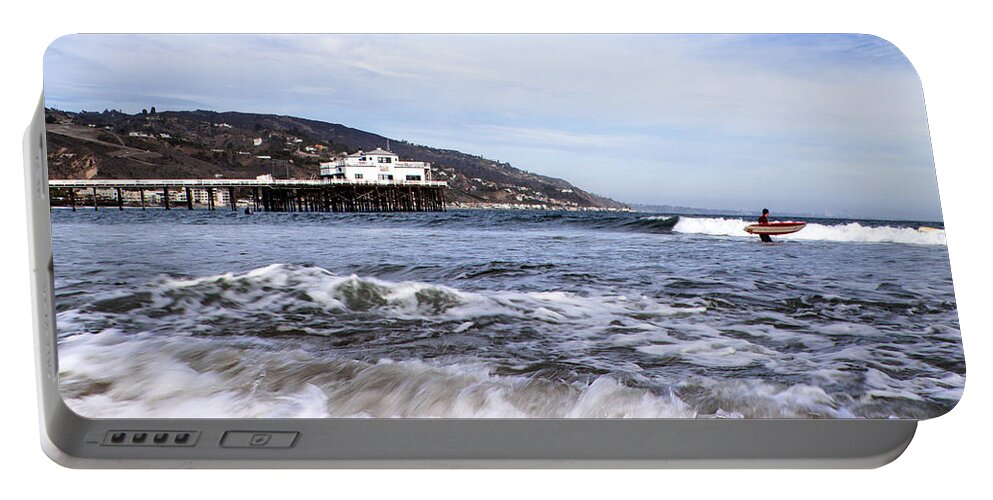 Malibu Beach Pier Photographs Portable Battery Charger featuring the photograph Ocean Waves Blue Sky And A Surfer At Malibu Beach Pier by Jerry Cowart