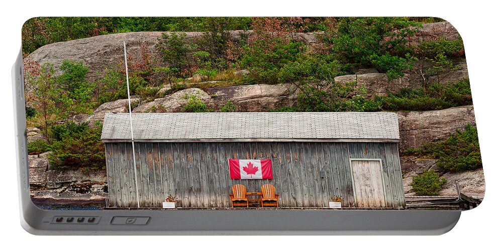Boathouse Portable Battery Charger featuring the photograph Old boathouse with two Muskoka chairs by Les Palenik