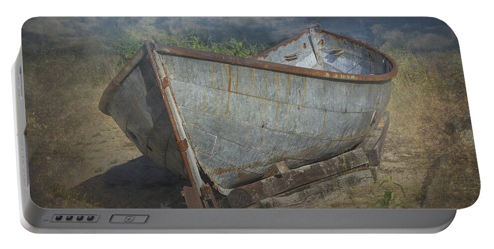 Art Portable Battery Charger featuring the photograph Old Historical Fishing Boat beached on the shore by Randall Nyhof