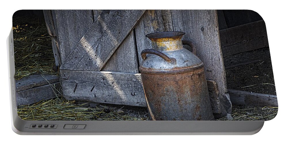Creamery Can Portable Battery Charger featuring the photograph Old Prairie Homestead Vintage Creamery Can by the barn door by Randall Nyhof