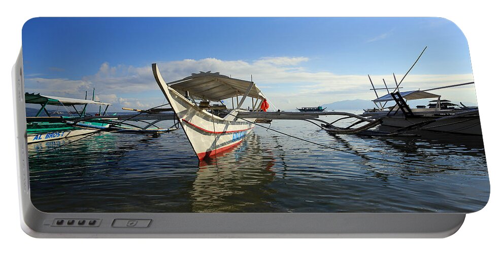 Outrigger Boat Portable Battery Charger featuring the photograph Outrigger boats by Paul Ranky