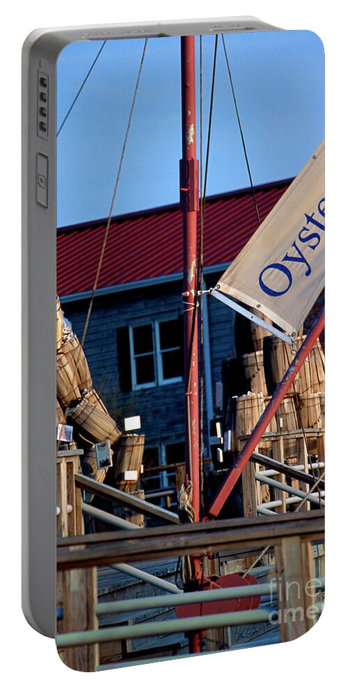 Oystering Portable Battery Charger featuring the photograph Oystering History at the Maritime Museum in Saint Michaels Maryland by William Kuta