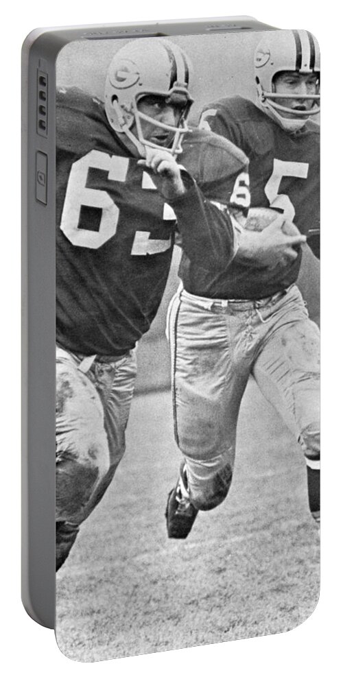 Paul Portable Battery Charger featuring the photograph Paul Hornung running by Gianfranco Weiss