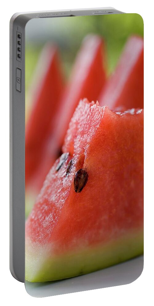 Bowler Hat Portable Battery Charger featuring the photograph Pieces Of Watermelon by Foodcollection
