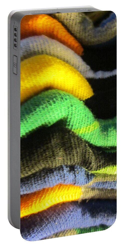 Socks Portable Battery Charger featuring the photograph Piled up by Rosita Larsson
