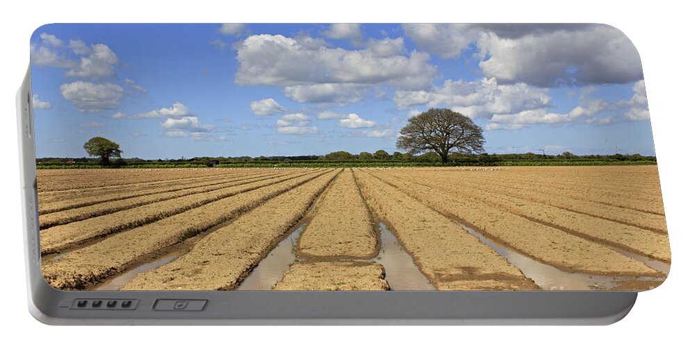 Ploughed Field Uk English British Landscape Countryside Furrow Tracks Converging Lines Earth Agriculture Farming Farmland Fertile Oak Fluffy Clouds Blue Sky Summer Portable Battery Charger featuring the photograph Ploughed Field by Julia Gavin