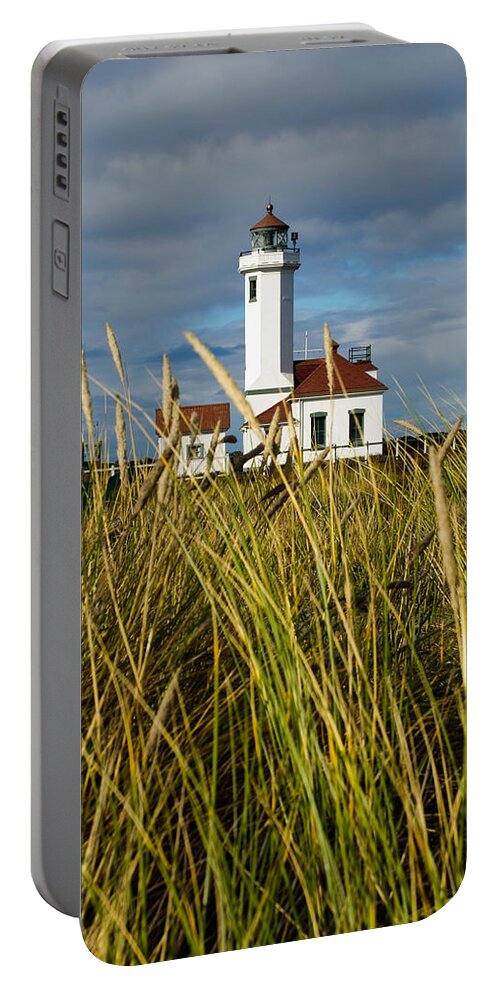 Architecture Portable Battery Charger featuring the photograph Point Wilson Lighthouse and Grassy Foreground by Jeff Goulden