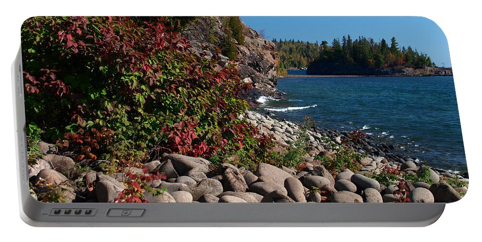 Nature Camping Camp Water Lake Superior Great Lakes James Peterson Split Rock Lighthouse State Park Parks Landscape Landscapes Seascape Seascapes Smooth Rocks Rocky Boulder Boulders Photography Weather Scenic Camping Fall Autumn Minnesota Mn North Shore Vista Serene Serenity Tranquil Vacation Destination Destinations Blue Skies Sky Morning Shoreline Stone Dramatic Beautiful Red Color Colors View Natural Season Stones Remote Outdoors Vivid Vibrant Crags America American Water Waters Pristine Portable Battery Charger featuring the photograph Pristine Shoreline by Melissa Peterson