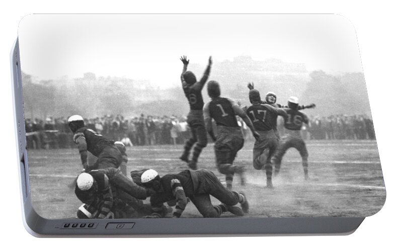 1920 Portable Battery Charger featuring the photograph Quarterback Throwing Football by Underwood Archives