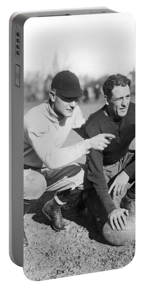 1920's Portable Battery Charger featuring the photograph Red Grange And His Coach by Underwood Archives