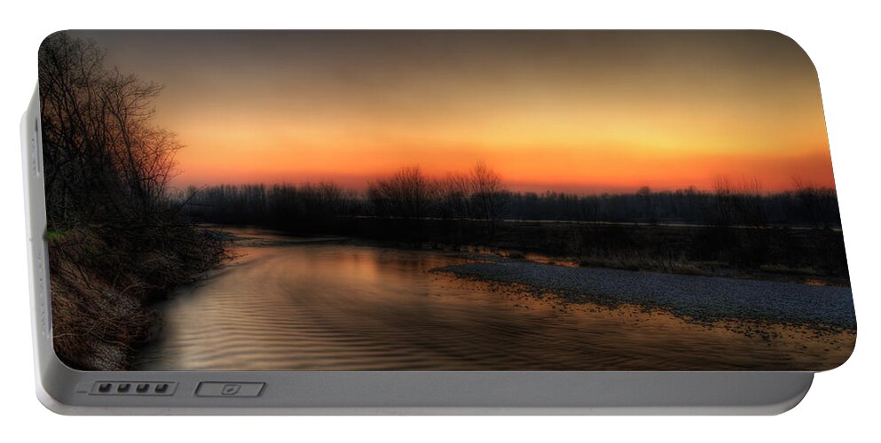 Details Enhancer Portable Battery Charger featuring the photograph Riverscape at sunset by Roberto Pagani