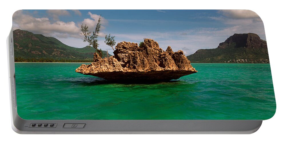 Photography Portable Battery Charger featuring the photograph Rock In Indian Ocean With Mountain by Panoramic Images
