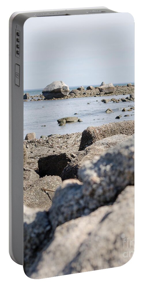 Sea Portable Battery Charger featuring the photograph Rocks on the beach by Andrea Anderegg