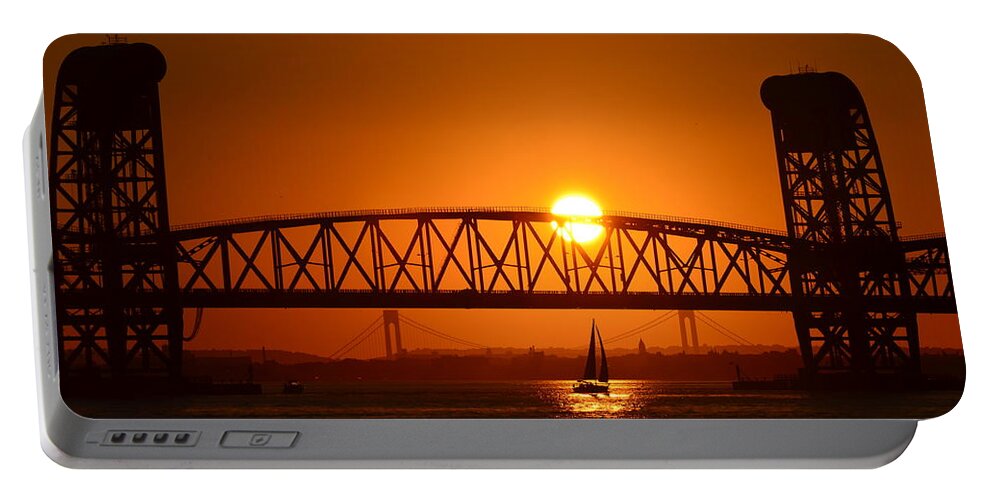 Sailboat Portable Battery Charger featuring the photograph Sailboat under Marine Park Bridge by Maureen E Ritter
