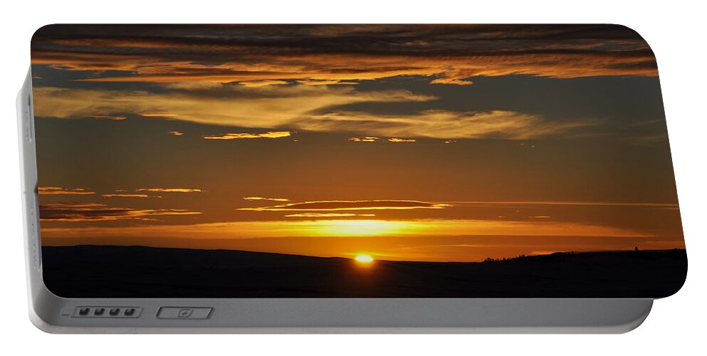 Sundown Portable Battery Charger featuring the photograph Setting Sun by Mike Helland