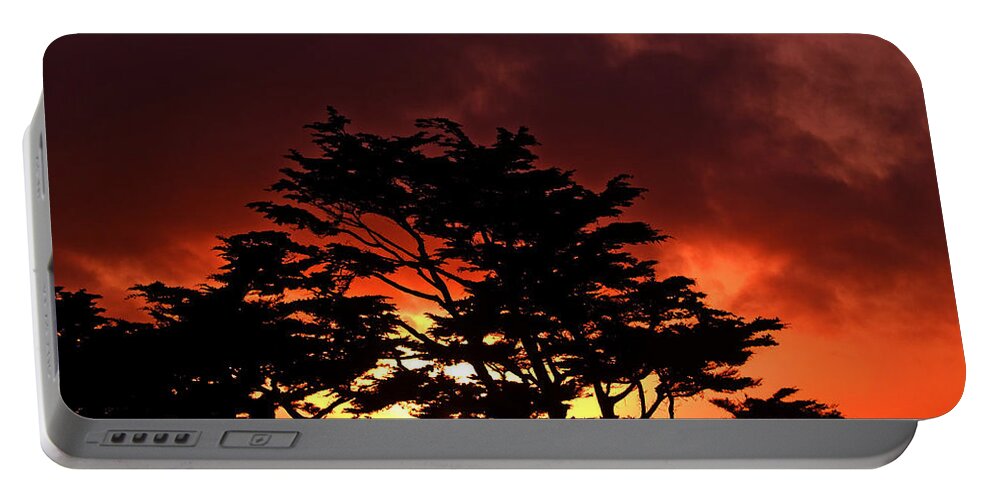Sunset Portable Battery Charger featuring the photograph Silhouetted Cypresses by Bill Gallagher