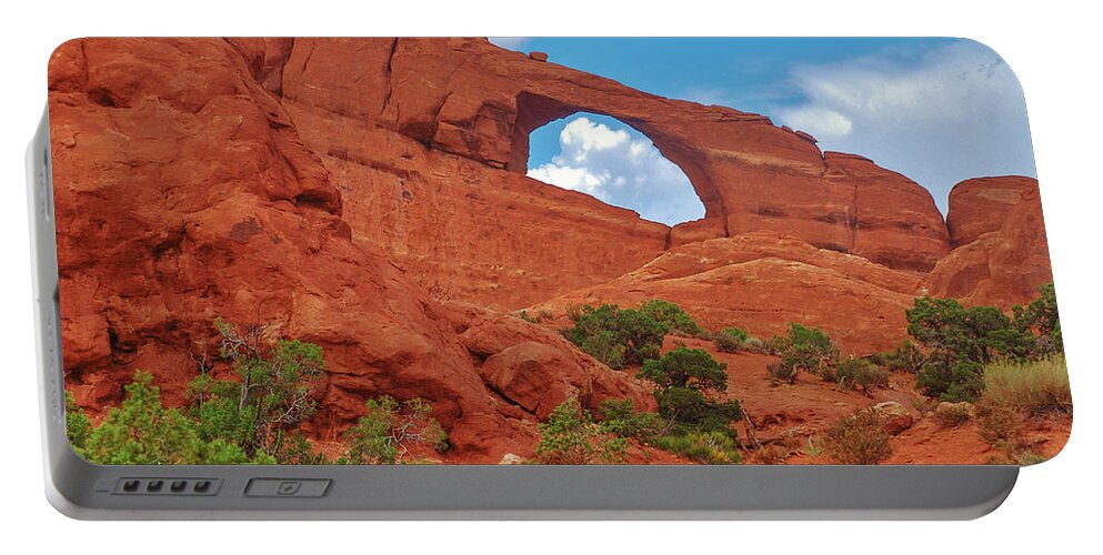 Sky Portable Battery Charger featuring the photograph Skyline Arch by Dany Lison