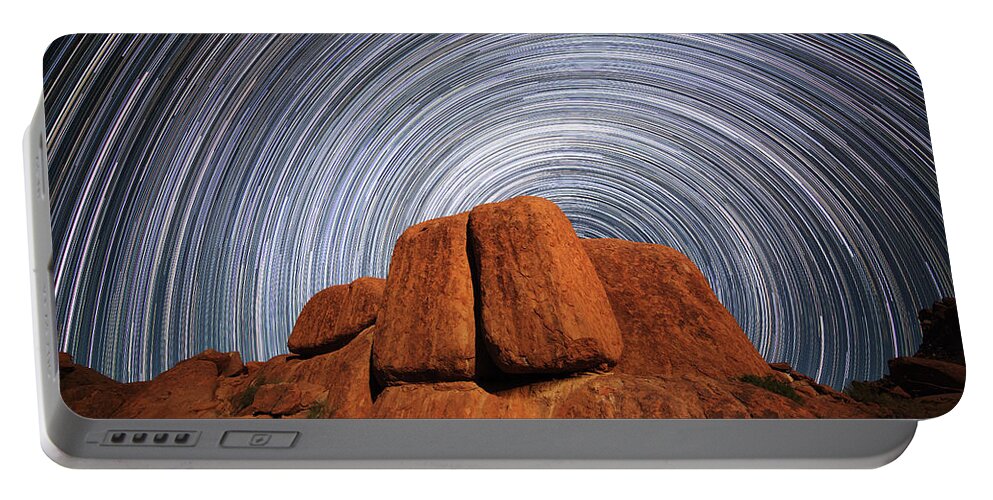 Blur Portable Battery Charger featuring the photograph Star Trails Above A Large Boulder by Robert Postma
