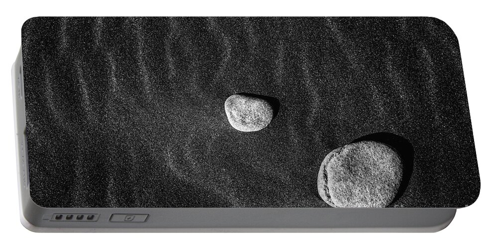 B & W Portable Battery Charger featuring the photograph Stones In The Sand by Gunnar Orn Arnason