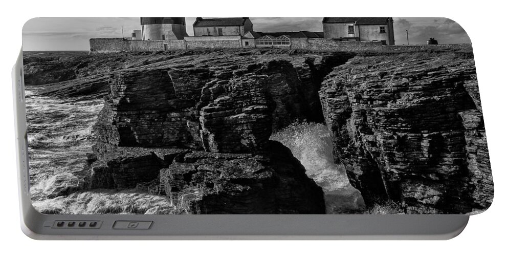 Hook Portable Battery Charger featuring the photograph Stormy day at Hook Head Lighthouse by Nigel R Bell