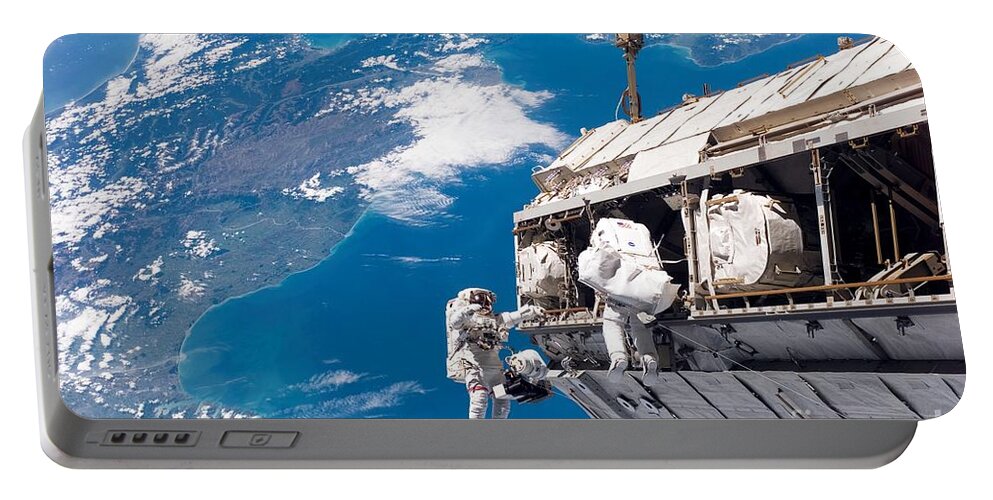 Backdropped By A Colorful Earth Portable Battery Charger featuring the photograph STS-116 Shuttle Mission Imagery by Paul Fearn