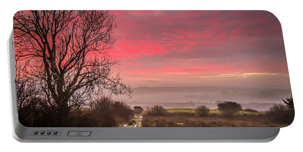 Ireland Portable Battery Charger featuring the photograph Sunrise over Decomade Pasture in County Clare by James Truett