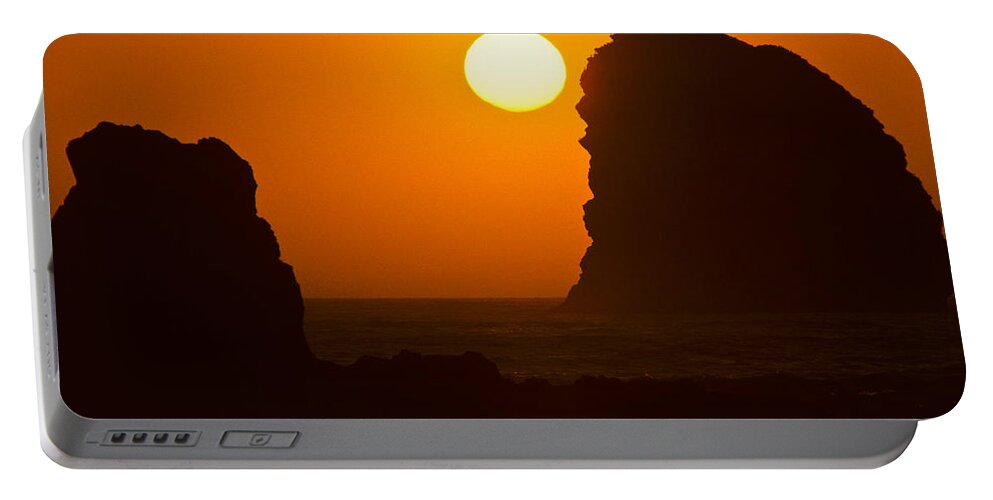 Beach Portable Battery Charger featuring the photograph Sunset Over the Pacific Ocean with Rock Stacks by Jeff Goulden