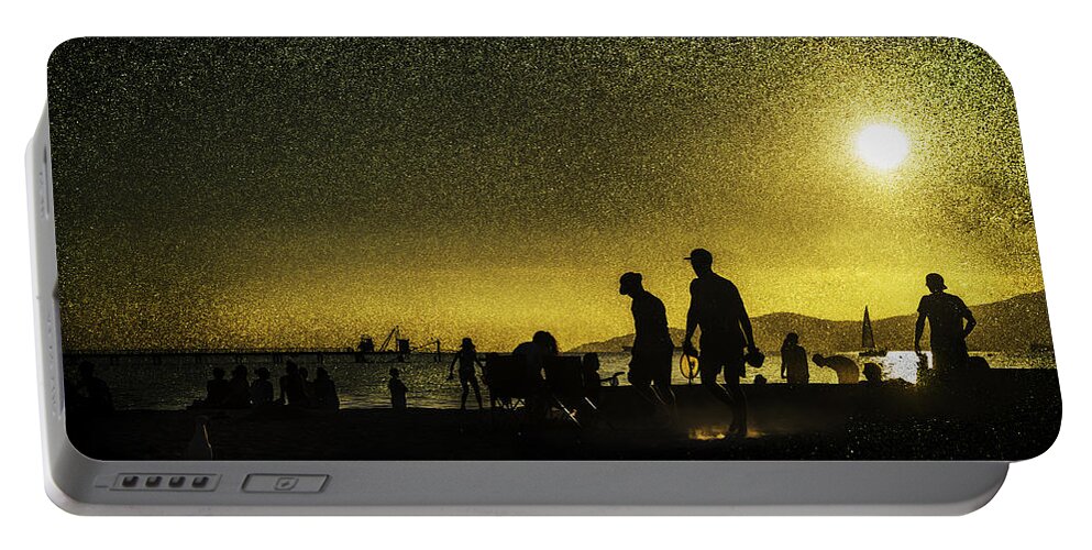Back Lit Portable Battery Charger featuring the photograph Sunset silhouette of people at the beach by Peter V Quenter