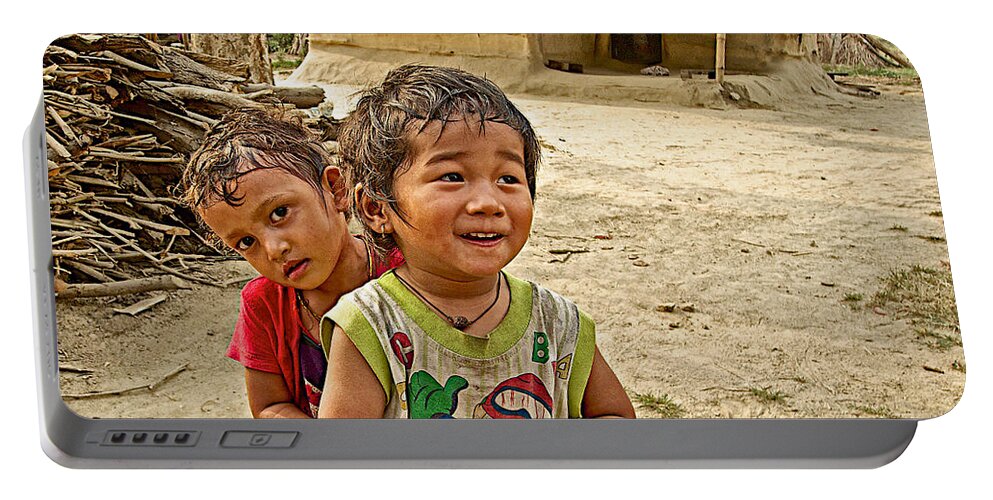 Tharu Village Children Love To Greet Us Portable Battery Charger featuring the photograph Tharu Village Children Love to Greet Us-Nepal- by Ruth Hager