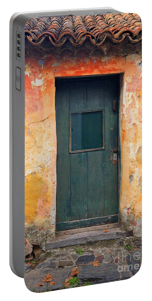 Colonia Del Sacramento Portable Battery Charger featuring the photograph The door by Bernardo Galmarini