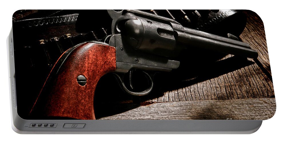 Revolver Portable Battery Charger featuring the photograph The Gun that Won the West by Olivier Le Queinec