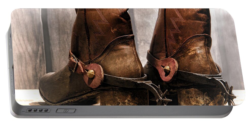 Cowboy Portable Battery Charger featuring the photograph The Muddy Boots by Olivier Le Queinec
