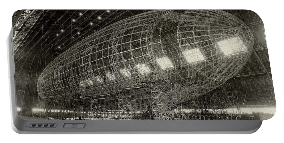 Horizontal Portable Battery Charger featuring the photograph The Nose Of Uss Akron Being Attached by Stocktrek Images
